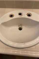 Bathroom sink faucet before replacement
